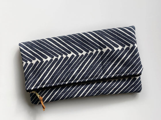 LARGE FOLDOVER CLUTCH in navy blue griffin